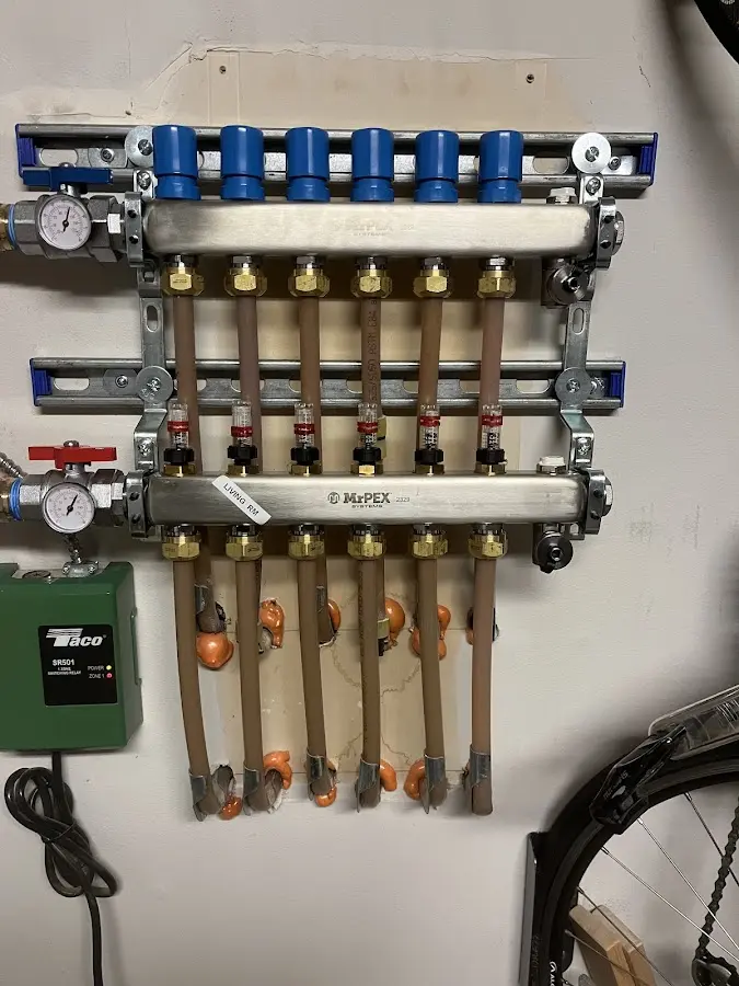 Plumber performing Water Heater Repair at a residential property in Brownsville